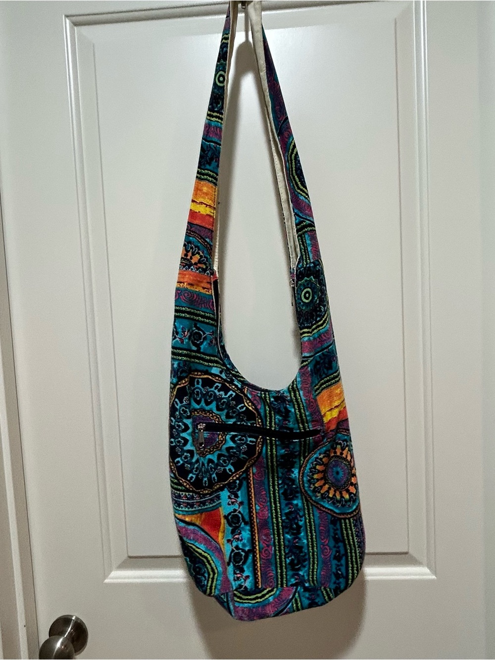 Bohemian Multicolor Crossbody Hobo Bag with zip close and zip pocket on outside